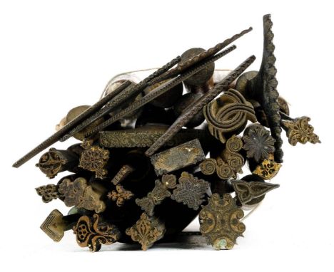 * Decorative finishing tools. A collection of 24 brass decorative finishing tools, comprising mostly centre and few corner to