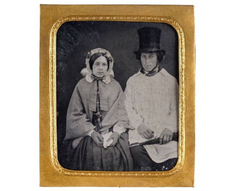 * Hampshire ambrotype. Portrait of a worker and his wife, 1850s, sixth-plate ambrotype of a seated couple, the man with a sto