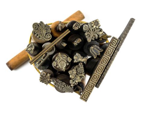 * Decorative finishing tools. 20 brass decorative finishing tools, including 11 centre tools of mostly traditional design, to