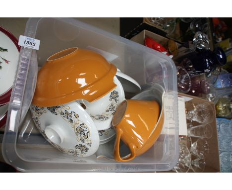 A quantity of Poole Pottery serving dishes, meat plate, dinner plates, gravy boat and saucer, 2 vegetable dishes and lids, si