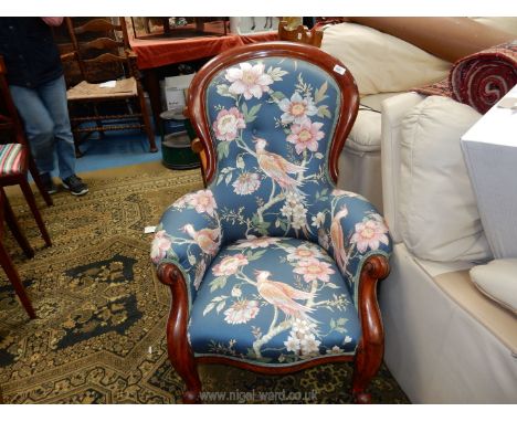 A circa 1900 Mahogany framed button backed Armchair having scroll detailed arms and front legs and upholstered in an attracti
