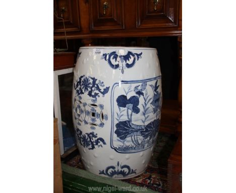 A blue and white pierced ceramic Stool with water lily and bird detail, 18 1/2'' tall.