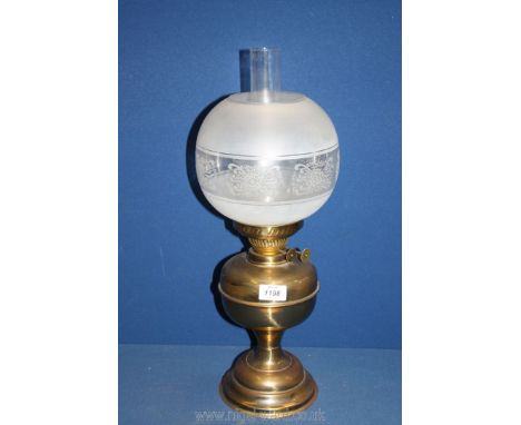 A brass double burner oil lamp with etched and frosted glass globe shade and clear glass chimney, some chips to shade and chi