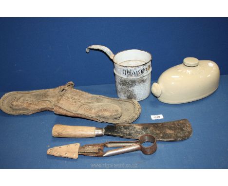 A Quaker Oats ladle, stoneware bed warmer and hedging gloves and tools.