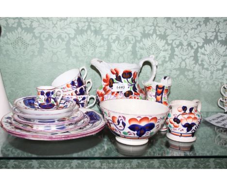A quantity of Gaudy Welsh china in Oyster design: two cake plates, three cups, saucers and tea plates, large jug, two smaller