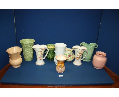 A quantity of jugs and vases including Falconware 678 dimpled and flared vase, two Arthur Wood embossed floral jugs, Crown De