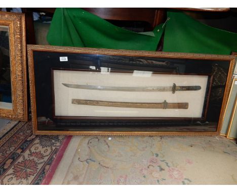 A gilded finished box frame containing a Japanese design Samurai sword and scabbard, 19 3/8'' x 44 1/2'' overall. [COLLECTION