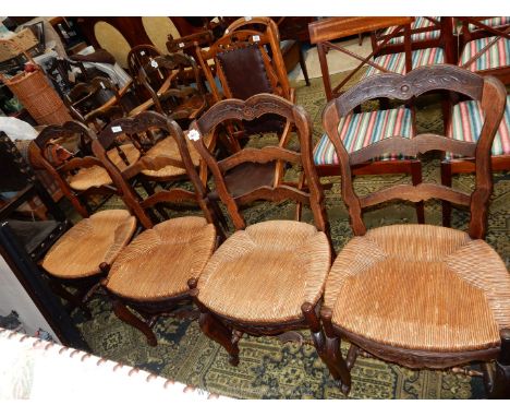 A set of four unusual seagrass seated Dining Chairs having ladder backs and carved top rail depicting a stylised flowering tw
