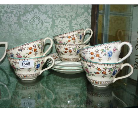 Six Copeland Spode 'Royal Jasmine' breakfast cups and saucers, the saucer centres having an advert for 'Fairfield Mabey Ltd, 