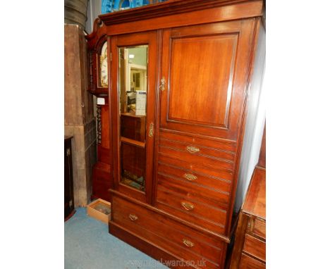 An Edwardian Mahogany Wardrobe with a bevelled mirror door, cupboard and three short drawers to the right hand side and a dee