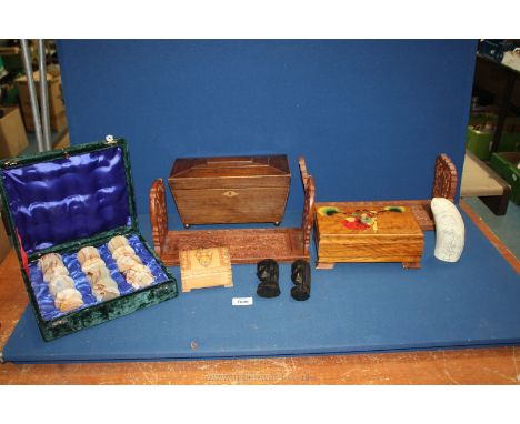 A quantity of miscellanea including two wooden carved sliding bookends, wooden tea caddy on brass bun feet, six onyx goblets,
