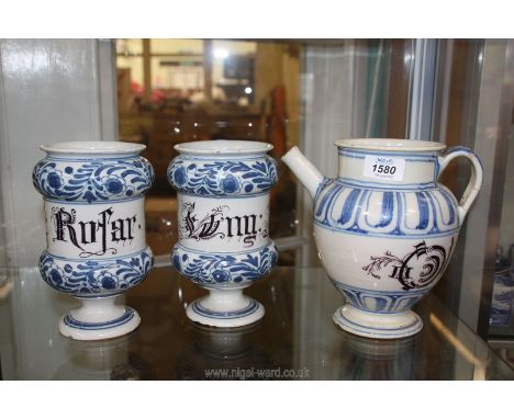 A pair of wide rimmed blue and white ceramic Apothecary jars, some chips to base, 7 1/2" tall and an Italian Wet Drug Jar, 8'