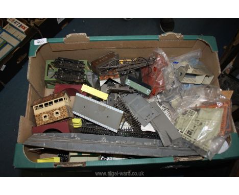A quantity of model train track, buildings, kits and scenery .