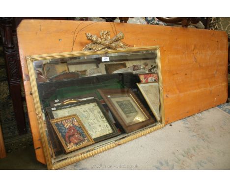 An attractive bevel edged wall Mirror with gilt frame and carved quiver of arrows and garlands to the top, 31" wide x 25" hig