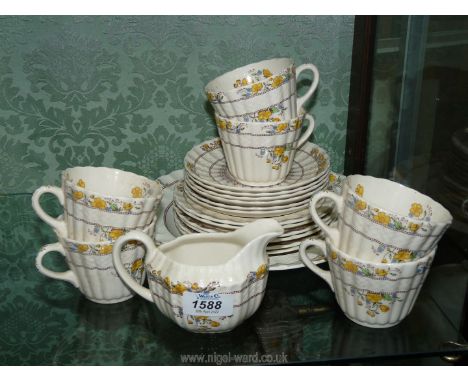 A Spode 'Buttercup' part tea service, six each cups, saucers, tea plates and milk jug.