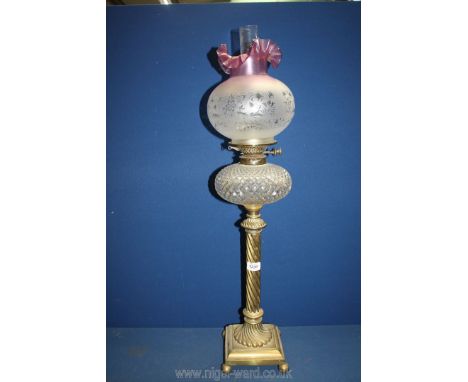 A double burner Oil Lamp on tall column with cut glass reservoir, chimney and purple glass fluted shade, 33'' tall.
