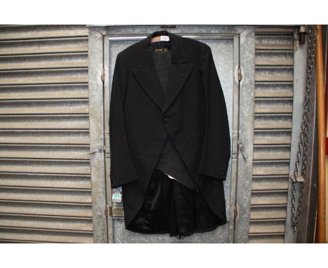 A black tail suit with grey pinstripe turn up trousers by Masters &amp; Co., bespoke tailors, 36'' chest x 36'' waist x 30'' 