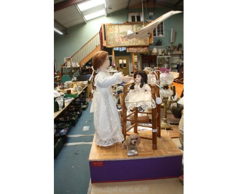 A vintage Automaton of two dolls and a dog, made in France by Guezille Animations, working order, 28'' wide x 10'' deep x 40'