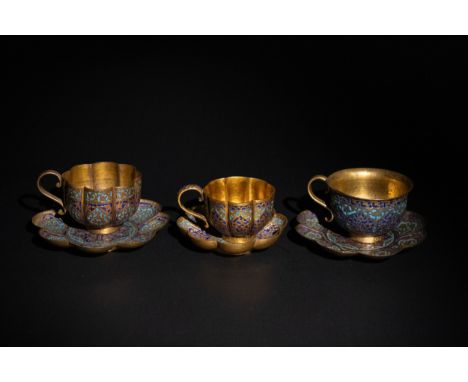 **NO RESERVE**A Set of Three Indian Kashmiri Mughal Gilt and Enamel Tea Cups with Saucers, 19th Century.A set of three tea cu