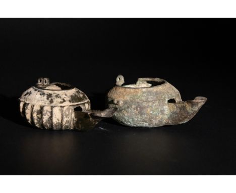 **NO RESERVE**A Pair of Islamic Khorassan Bronze Oil Lamps, 12th Century.A pair of Islamic bronze oil lamps from the Khorassa