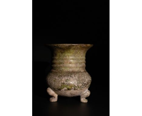 **NO RESERVE**A Chinese Jade Tripod Vase with a Weathered Green Patina.A Chinese jade vase standing on three curved feet, fea