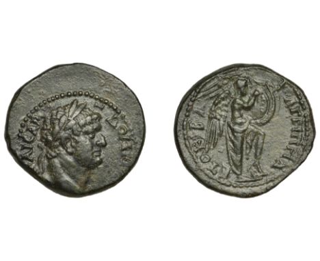 Judaea, Domitian, Æ unit, Caesarea Panias mint, laureate bust right, rev. Nike standing right with foot on helmet, resting sh