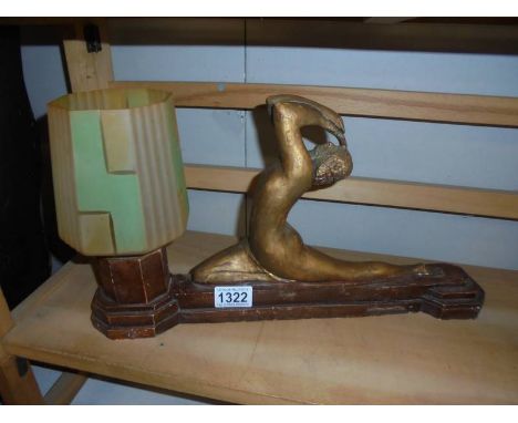 An art deco plaster nude figurine table lamp.