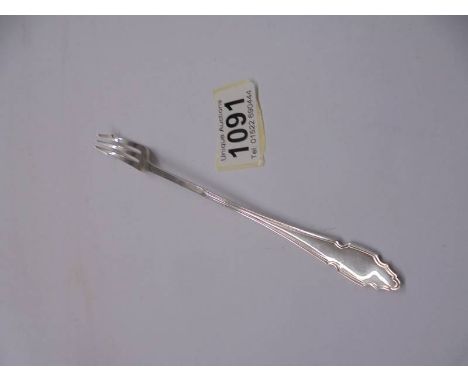 A hall marked silver pickle fork.