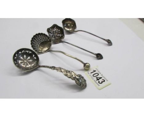 Three silver plate sifter spoons and a small silver plate ladle.