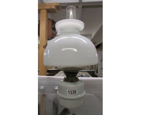 A Glass oil lamp font complete with burner and shade. COLLECT ONLY.