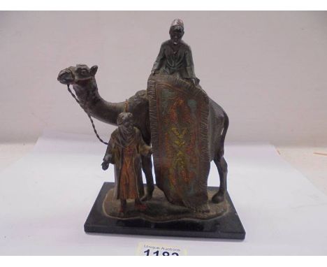 An early 20th century Austrian carpet seller with camel striker lighter (missing wand).