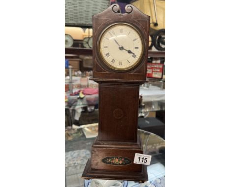 An Edwardian inlaid mantle clock. Height 38cm.