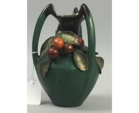 ARTS &amp; CRAFTS CONTINENTAL THREE HANDLED VASE,decorated in relief with fruiting branches, 19cm high, along with an orange 