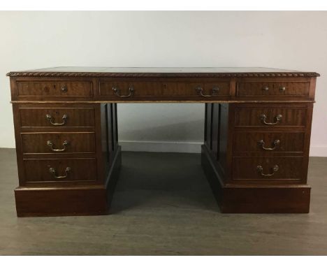 EARLY 20TH CENTURY MAHOGANY PEDESTAL WRITING DESK,with gilt tooled green leather skiver, with gadrooned border, frieze drawer