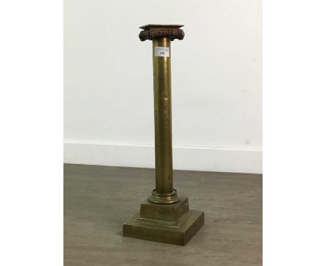LARGE BRASS CANDLESTICK,modelled in the form of an ionic column, 49.5cm high