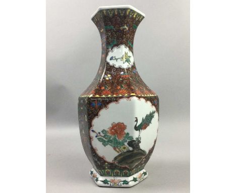 CHINESE HEXAGONAL BALUSTER VASE,decorated with peacocks within C-scroll cartouches, character marks to base, 31cm high