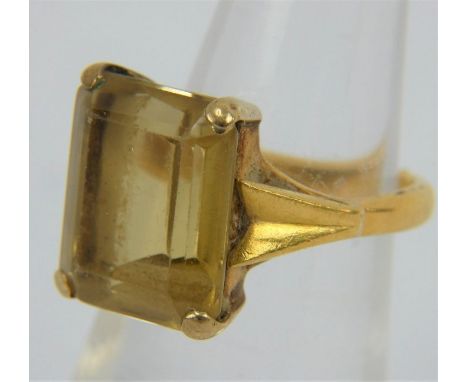 A 22ct gold emerald cut yellow topaz set ring, size J, gross weight 6.2 grams