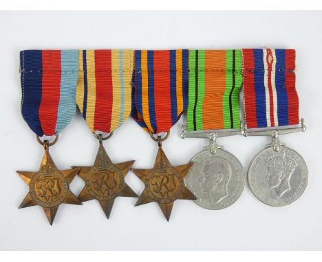 WWII British Army medal group including Defence medal, War Medal, 1939-1945 Star, Africa Star and Burma Star. Presented to Jo
