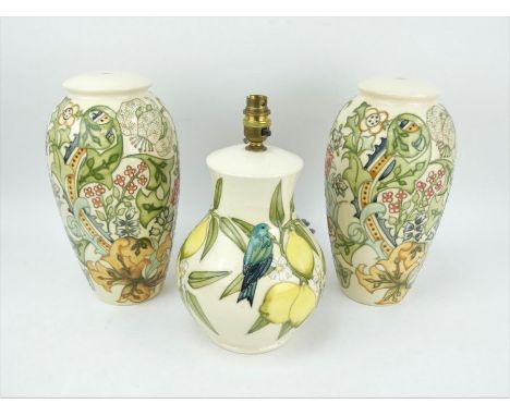 A pair of Moorcroft Pottery table lamp bases and a Moorcroft blue bird and lemon tree pattern table lamp.&nbsp; Tallest: 33cm
