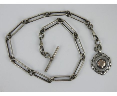 A heavy long link silver watch albert chain and fob, each link stamped with a lion passant. Gross weight: 66 grams, 2.12 troy