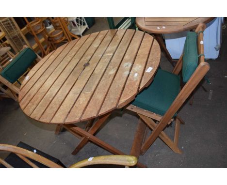 Circular garden table and two folding chairs