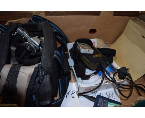 Olympus OM10 camera together with travel bag and various accessories