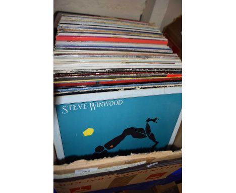 Box containing a large quantity of album/12 inch records including Steve Winwood, Madness, Buddy Holly, Barbara Streisand, Br