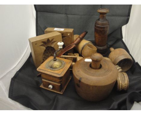 A large collection of mainly 19th Century treenware butter moulds, including two 2-section pieces,  finely carved scallop she