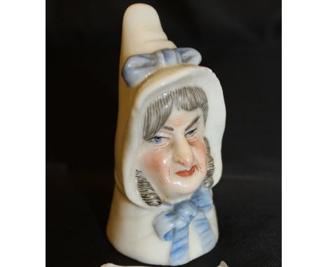 A Royal Worcester candle snuffer "Mrs Caudle" date marked for 1893