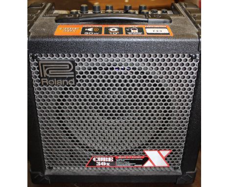 A Roland Cube 30X 34W speaker amp
