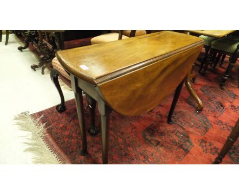 A George II red walnut gate leg table