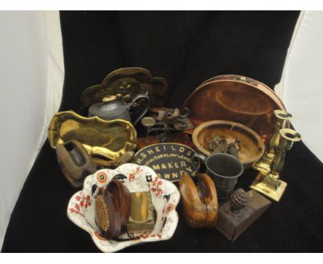 A box of sundry metal and treen ware to include three various pulley blocks, oil lamp, pair of brass candlesticks, pewter mug