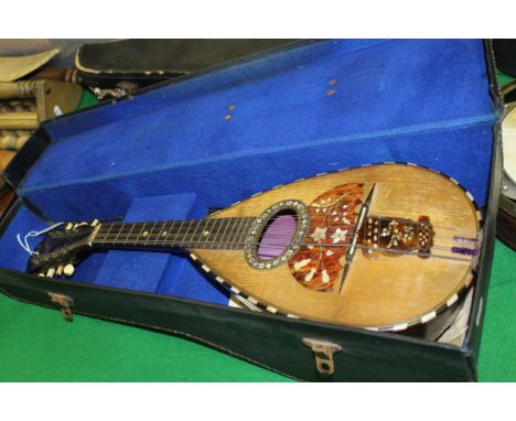 A rosewood mother of pearl and tortoiseshell inlaid mandolin by Domenico Zanoni of Napoli, bearing label to interior and ivor
