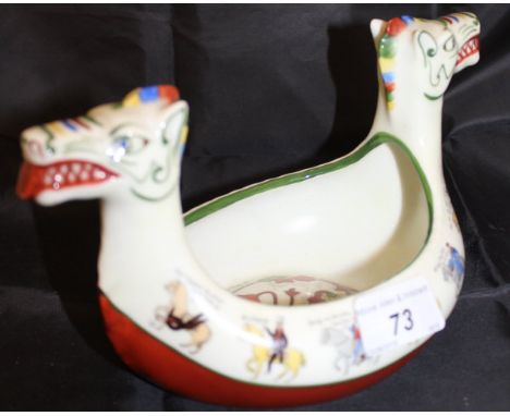 A Porstrund of Norway posy vase of Viking longship form with figural and script decoration CONDITION REPORTS Some light scrat